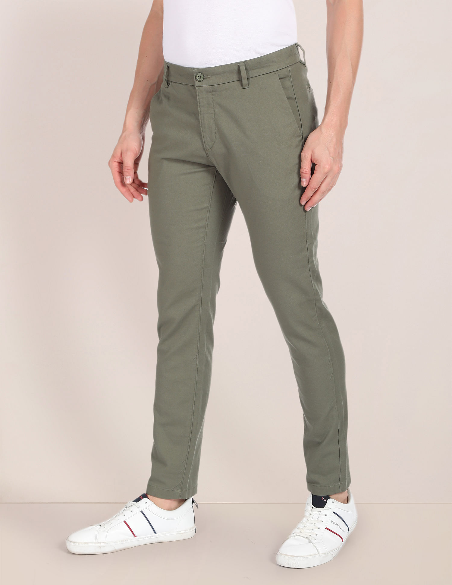 Buy U.S. Polo Assn. Men Khaki Slim Fit Solid Regular Trousers on Myntra |  PaisaWapas.com