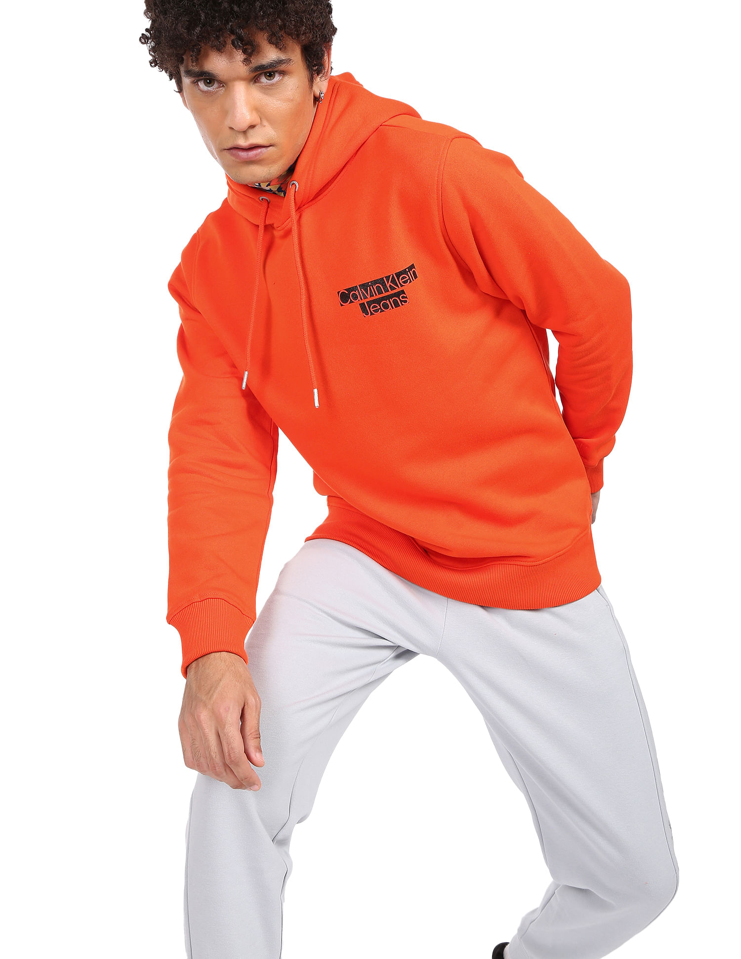 Buy Calvin Klein Men Orange Solid Hooded Sweatshirt NNNOW