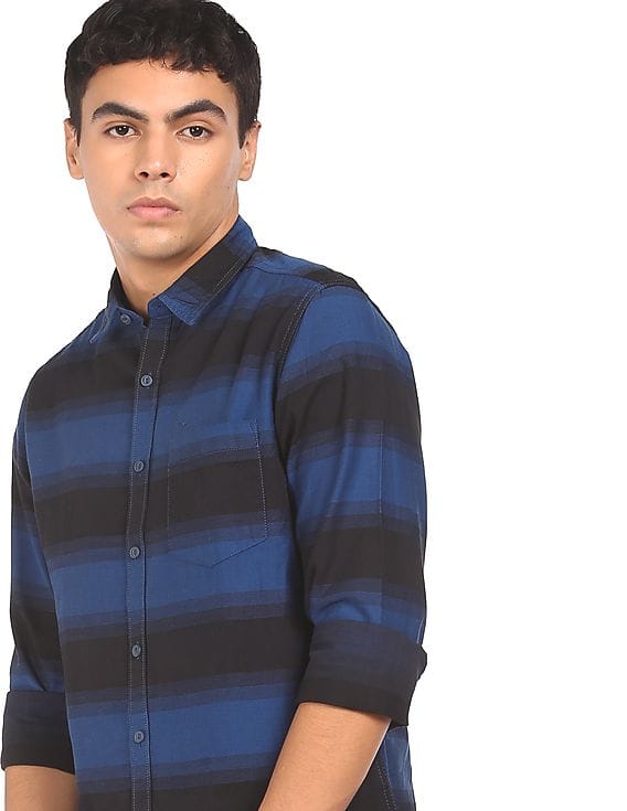 black paint and blue shirt