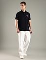 Tommy Hilfiger Solid Regular Fit Cotton Polo T-Shirt